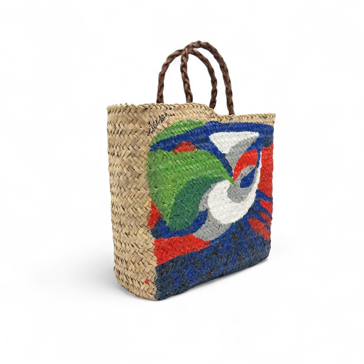 Vista dall'interno della borsa in paglia dipinta a mano, che ne mostra la capienza.