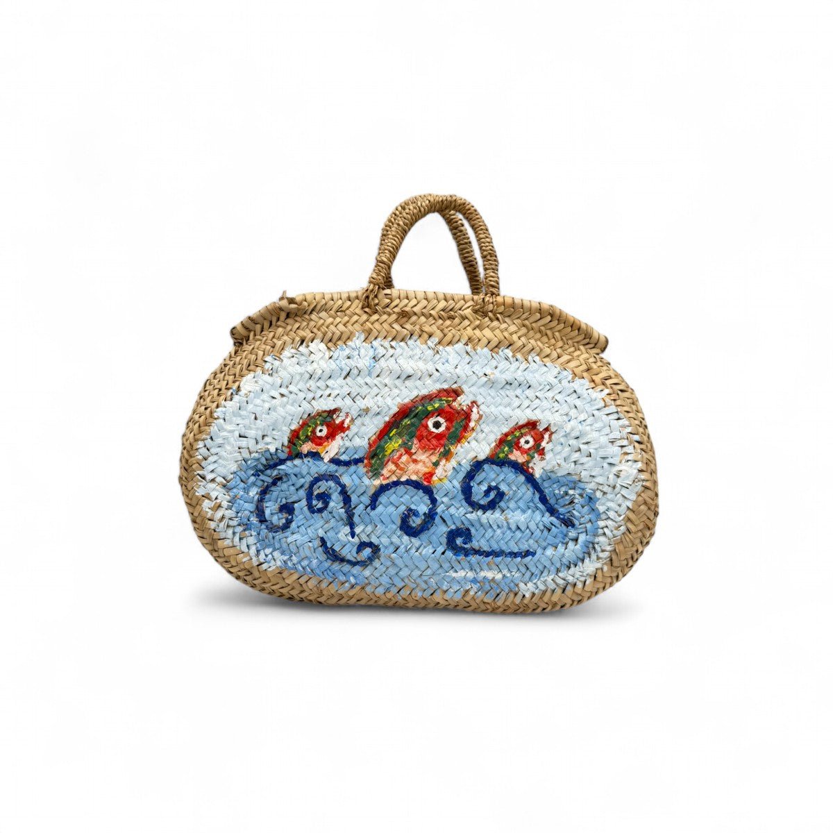 Dettaglio della paglia intrecciata resistente e dei manici della borsa artigianale.