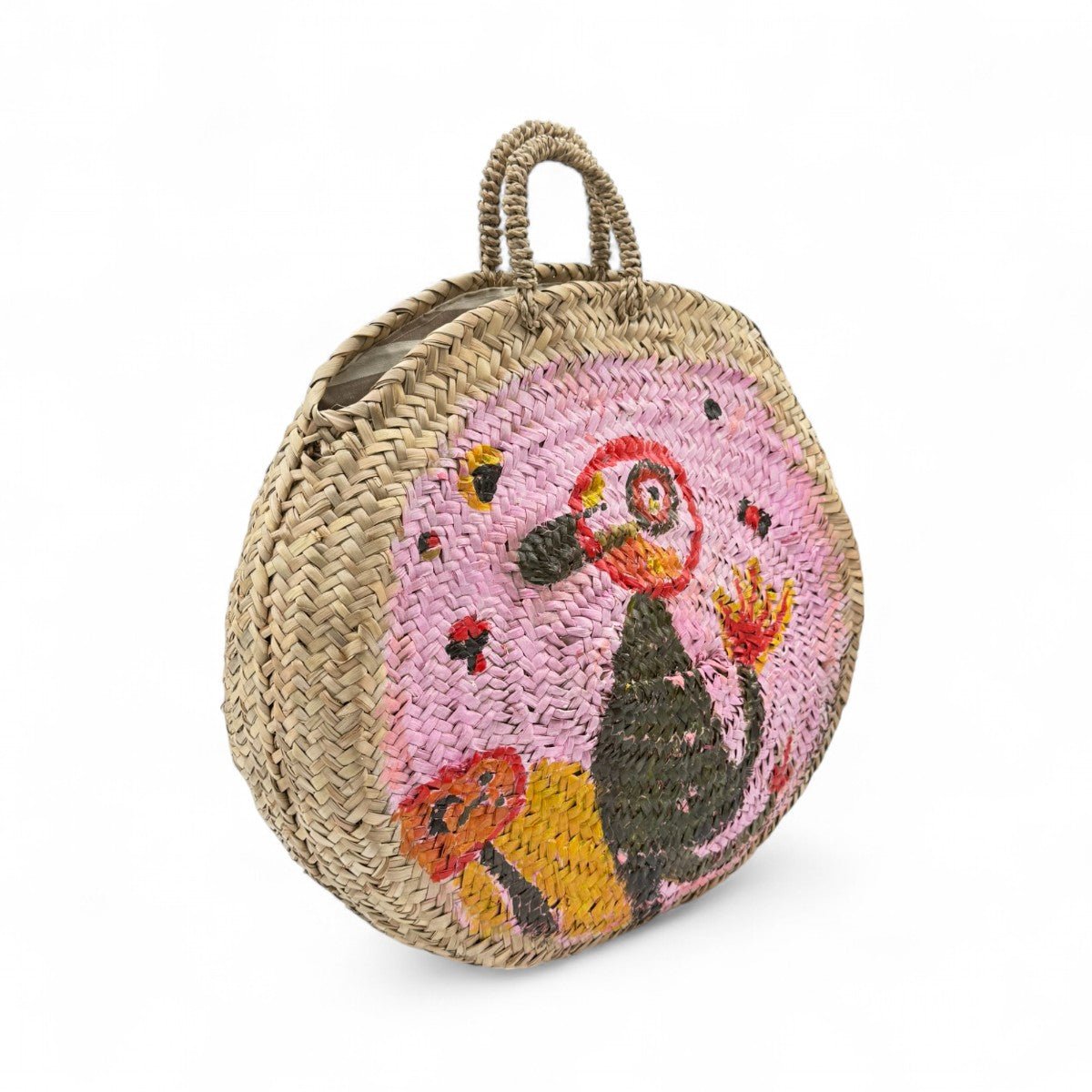 Dettaglio della paglia intrecciata e della forma rotonda della borsa Porto Cervo.