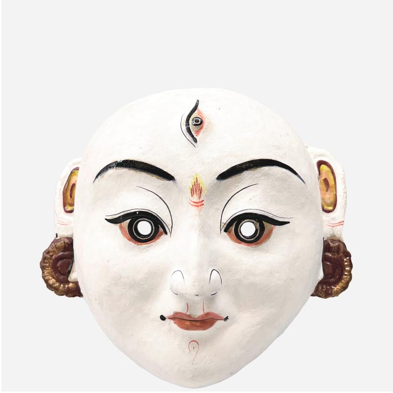 La Maschera di Durga su una parete colorata in un salotto in stile etnico-chic.