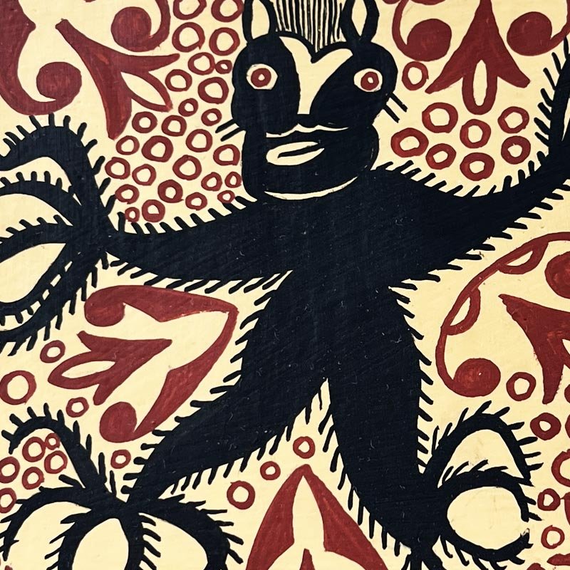 Una Mattonella Socarrats "El Pez" usata come decorazione murale in una cucina rustica.