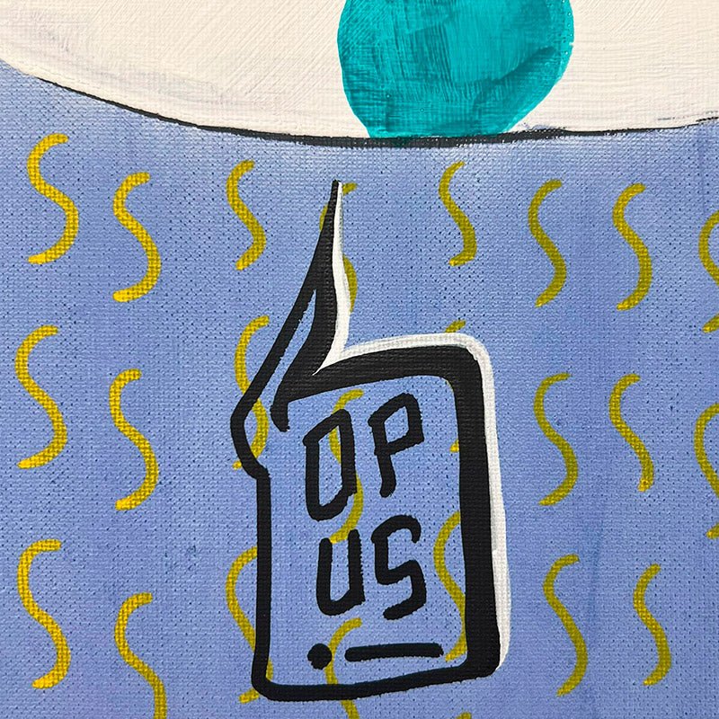 Il Quadro Buddha di Uodi appeso a una parete di mattoni, in un ambiente urbano.