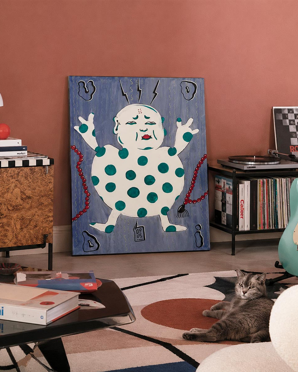 Quadro Buddha, dipinto originale dell'artista Emiliano dalle Piagge (Uodi) in uno spazio di design stile sottsass