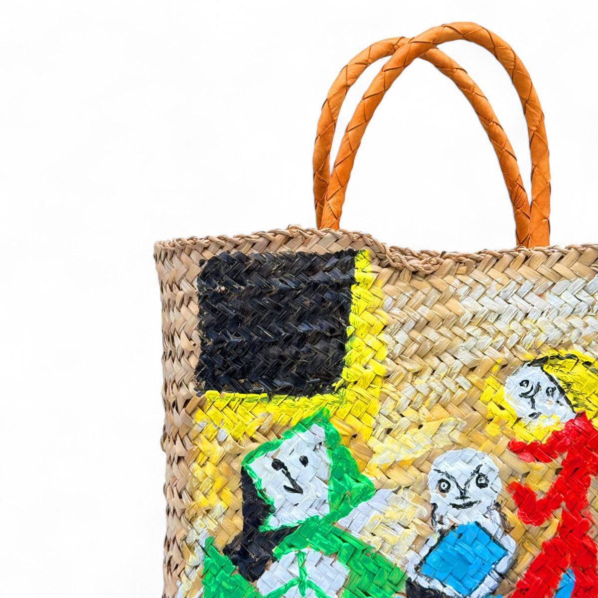 La borsa in paglia Santorini mostrata con la sua dust bag e il certificato di originalità.