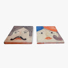 Vista di tre quarti della coppia di mattonelle Idda & Iddu, che ne evidenzia il dialogo.