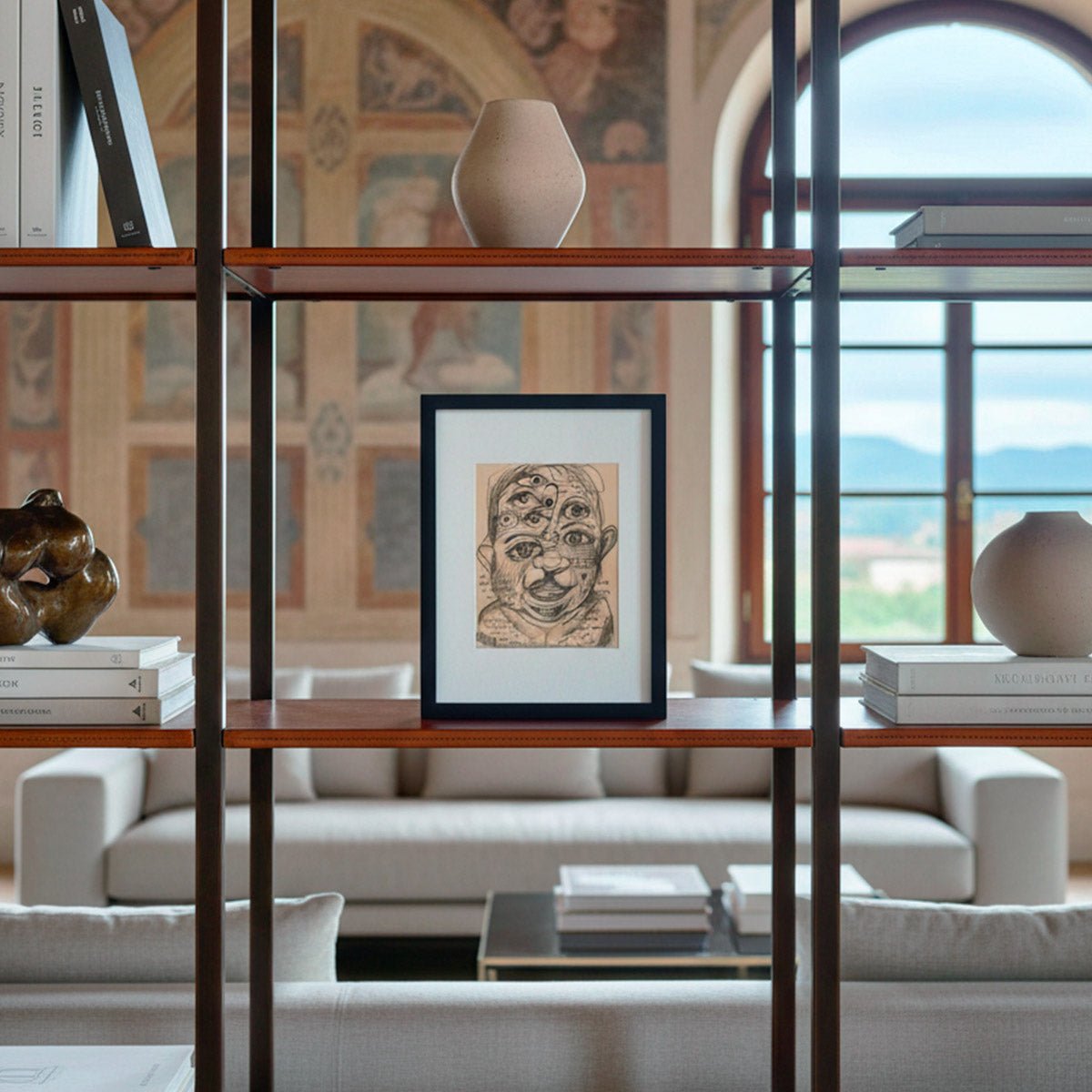 Il quadro Sguardi Inconscio di Massimiliano Precisi, all'interno di una libreria, in un living moderno di design