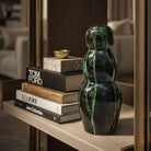 Vaso a goccia in ceramica nera con colature verde smeraldo