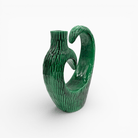 Opera unica in ceramica smaltata verde scuro con riflessi